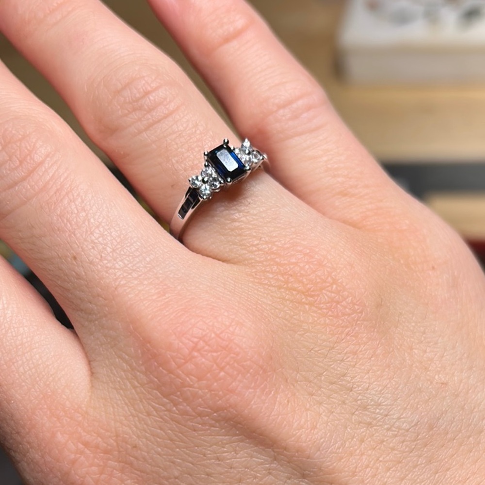 Zales 14 karat white gold ring w/ sapphire stones & flower detailing